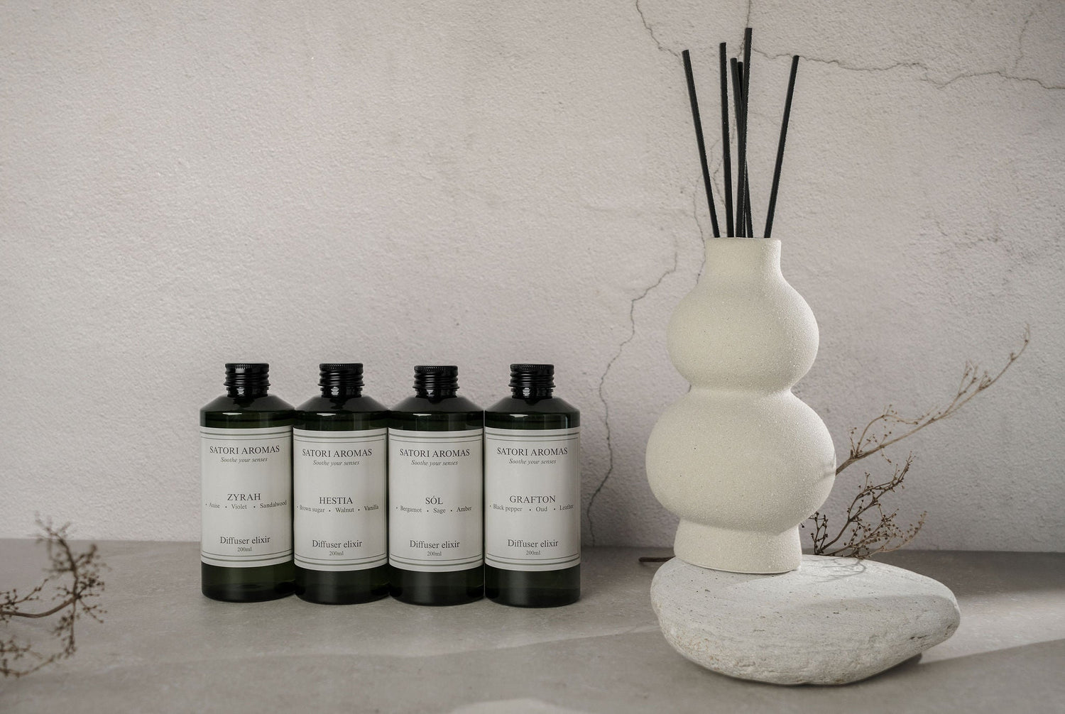 Luxury reed diffusers in concrete vases by Satori Aromas - refillable home fragrance diffusers