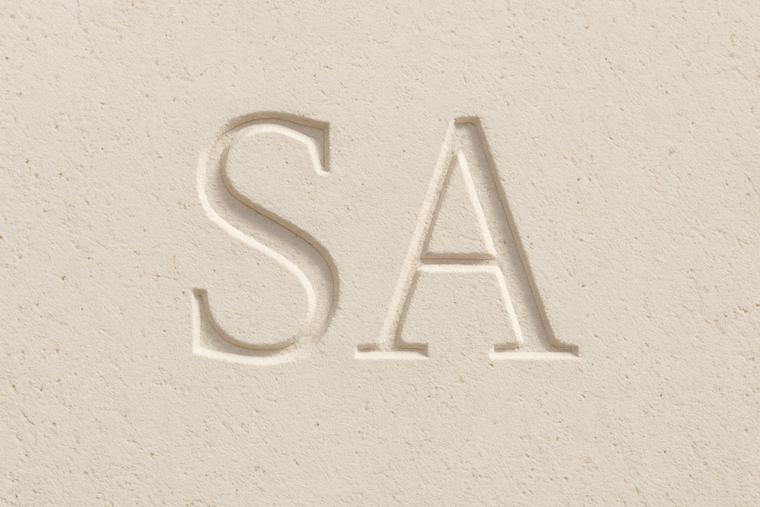 SA carved in light concrete with smaller letters